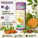 Gélules Bael Bilva Bio Ayur-Vana avec posologie, fruits et herbes médicinales sur fond blanc