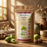 Bibhitaki Bio poudre Ayurvana avec fruits frais sur surface bois naturelle