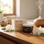 Cire orientale vegan Acorelle en pot verre dans salle de bain spa avec fleurs