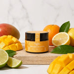 Déodorant solide bio Najel Mangue citrus avec fruits frais sur surface bois