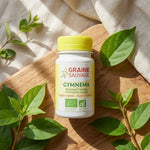 Flacon Gymnema Sylvestris bio vegan avec feuilles vertes et lumière naturelle
