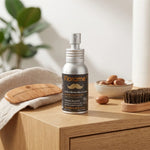 Flacon d'huile à barbe bio Florame avec emballage argent sur vanité en bois