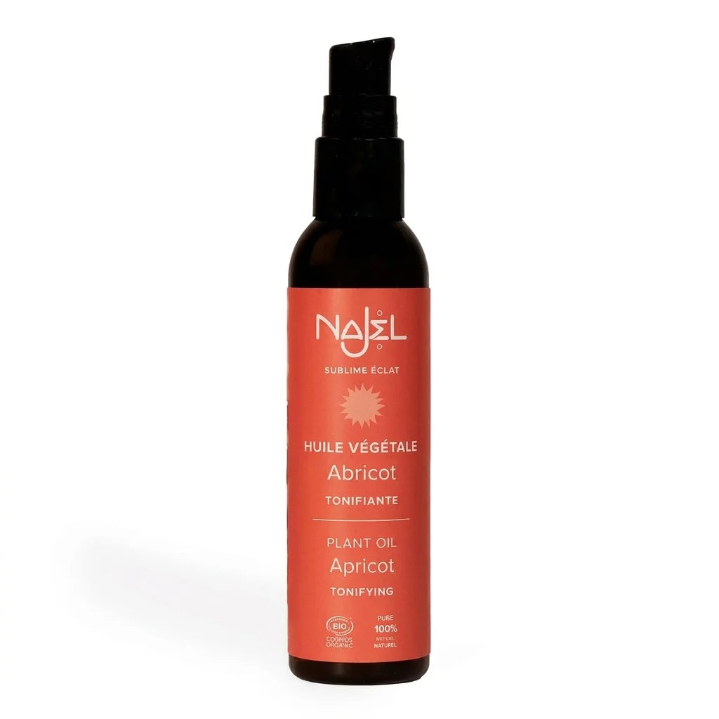 Huile d'abricot bio Najel en flacon spray sur fond blanc, produit certifié
