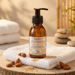 Huile de massage bio Florame base neutre en flacon ambré dans un décor spa relaxant