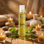 Huile de massage Kapha bio Ayurvana 100ml avec herbes et pierres sur bois