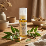 Bouteille Huile de Neem bio Ayurvana avec feuilles fraîches sur fond naturel minimaliste