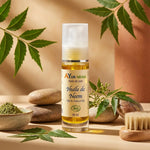 Bouteille d'Huile de Neem bio Ayurvana sur vanity wellness avec feuilles de neem et pierre naturelle