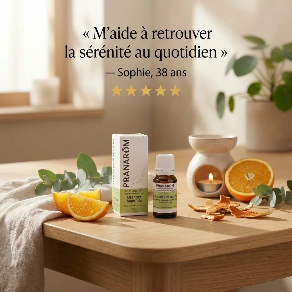 Pranarom Huile Essentielle d'Oranger Bigarade 10ml avec tranches d'orange frais et diffuseur céramique sur table bois