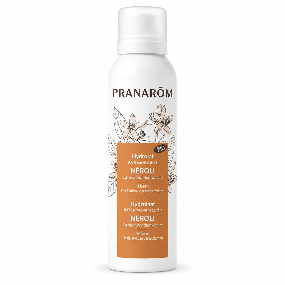 Hydrolat bio neroli Pranarom en flacon spray avec fleurs blanches et produits de soin

