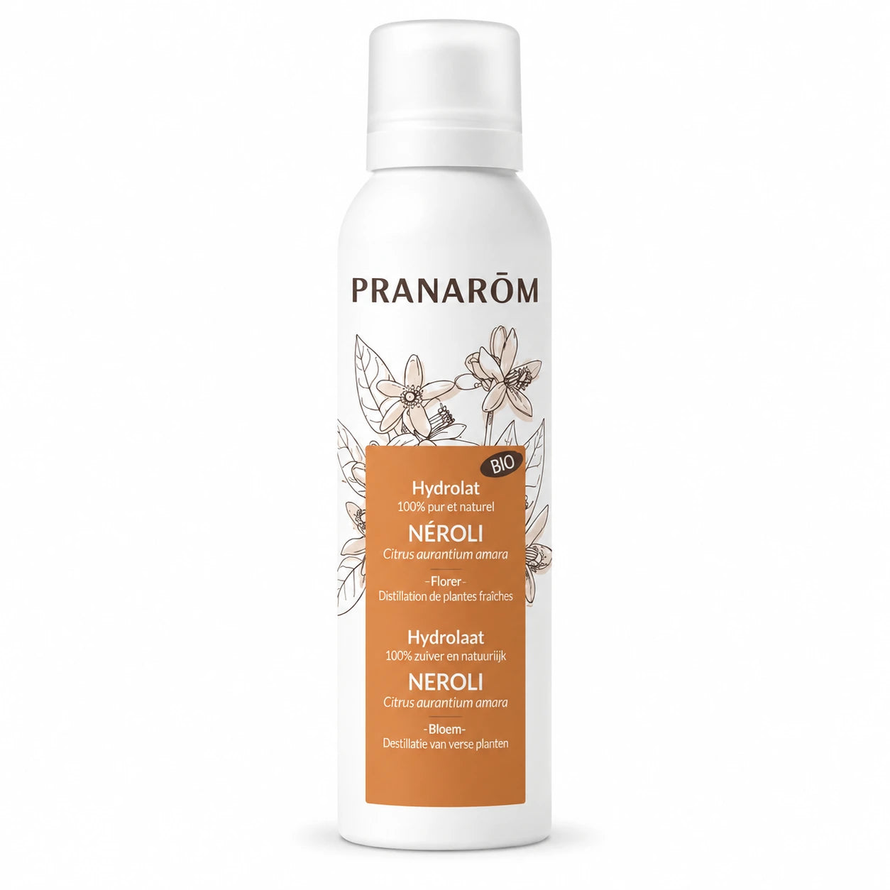 Hydrolat bio neroli Pranarom en flacon spray avec fleurs blanches et produits de soin

