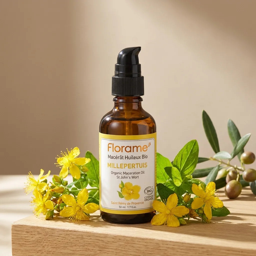 Macérat huileux de Millepertuis bio Florame avec fleurs jaunes et feuilles vertes sur bois