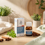 Oleobiotic Pranarom capsules digestives en flacon ambré sur fond minimaliste avec herbes naturelles