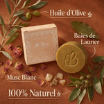 Savon d'Alep Musc Al Bara avec emballage, ingrédients naturels olive et laurier sur fond terracotta
