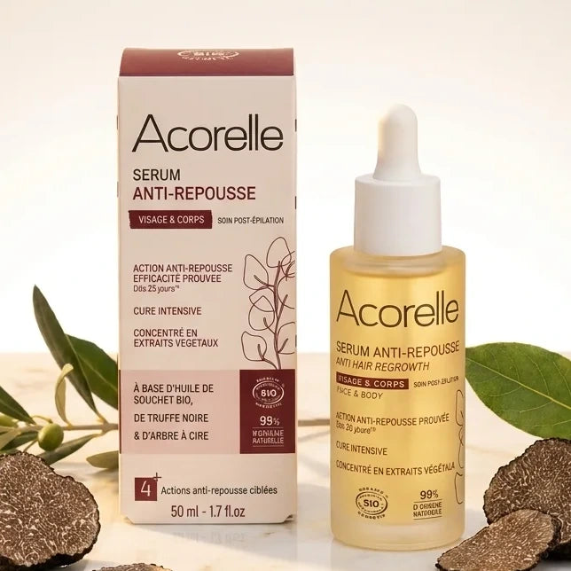 Sérum Anti-repousse Bio Acorelle en flacon avec pipette sur surface marbre