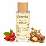 Huile SOS bio Acorelle avec flacon et ingrédients naturels sur fond blanc