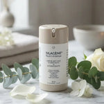SILAGÈNE® Nutri-Intense flacon crème avec cap beige sur marbre, botaniques frais, ambiance spa luxe