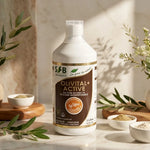 Bouteille Olivital+ Active silicium boisson SFB sur marbre avec feuilles botaniques et lumière naturelle