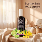 Spray Ylang Bergamote Aromaspray dans chambre lumineuse avec fleurs et agrumes